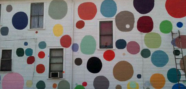 small section of building with Tyree Guyton's art at The Heidelberg Project exhibition